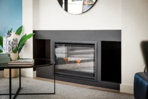Modern living room featuring a fireplace with a sleek, frameless glass screen, enhancing both safety and style.