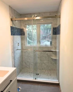 custom shower glass enclosure that keeps your bathroom bright and open.