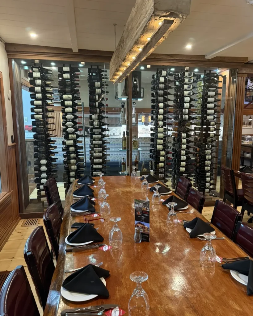 Frameless glass wine room display in restaurant setting in Barnstable MA