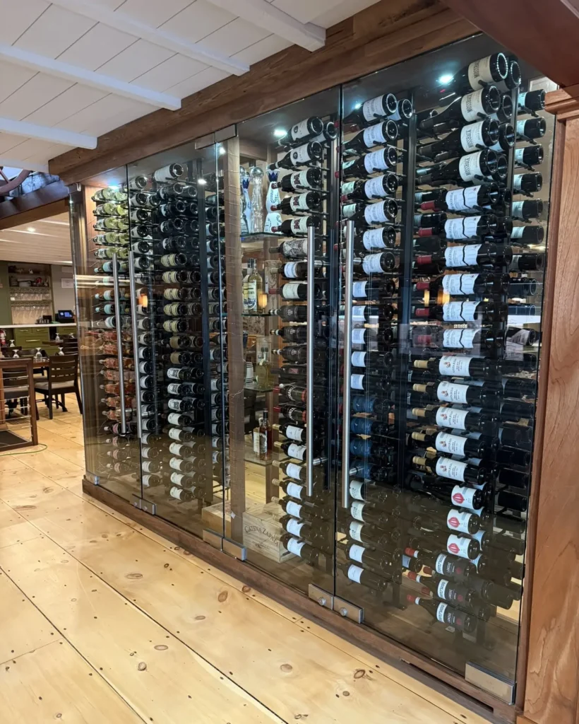 Custom commercial frameless glass wine cellar enclosure installed in Barnstable MA