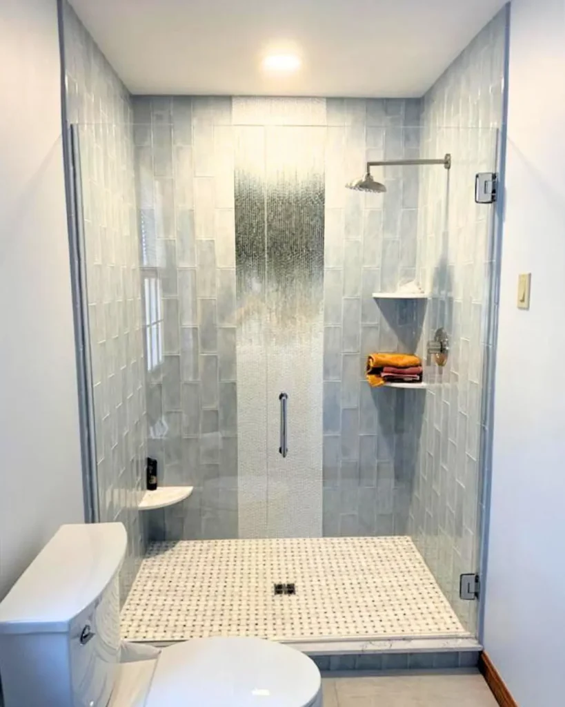 Frameless swing glass shower door with chrome hardware installed in Centerville MA
