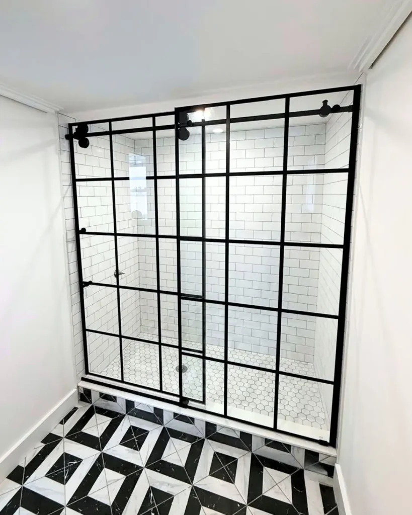Matte black grid glass shower door installation with subway tile in Portsmouth RI